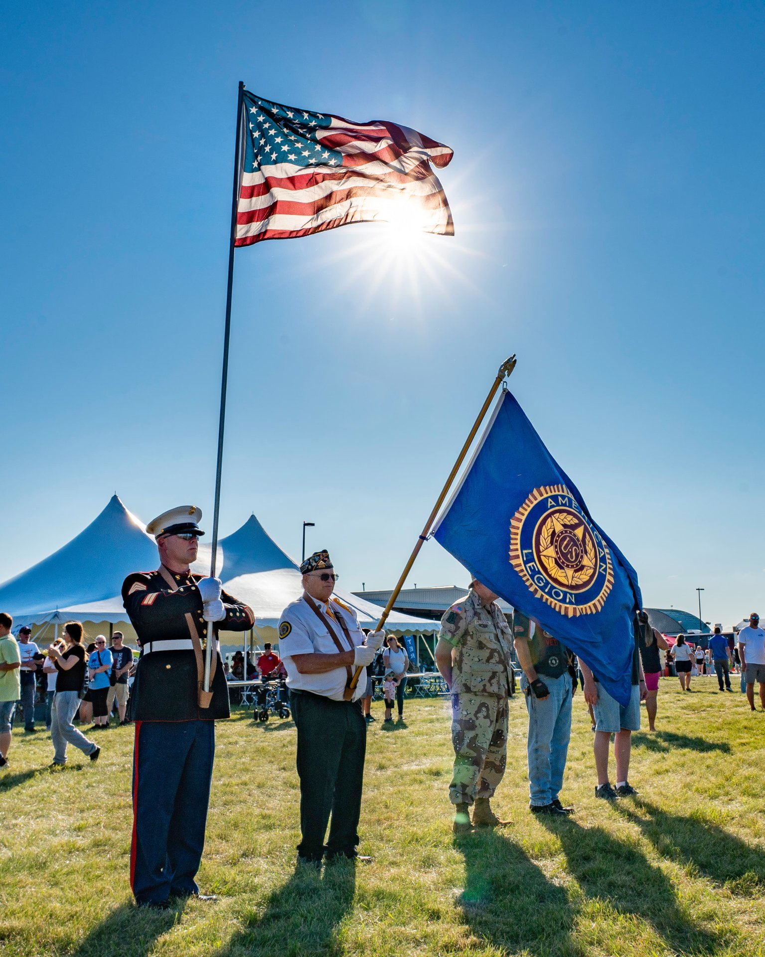 Veterans holding the American and American Legion Flags