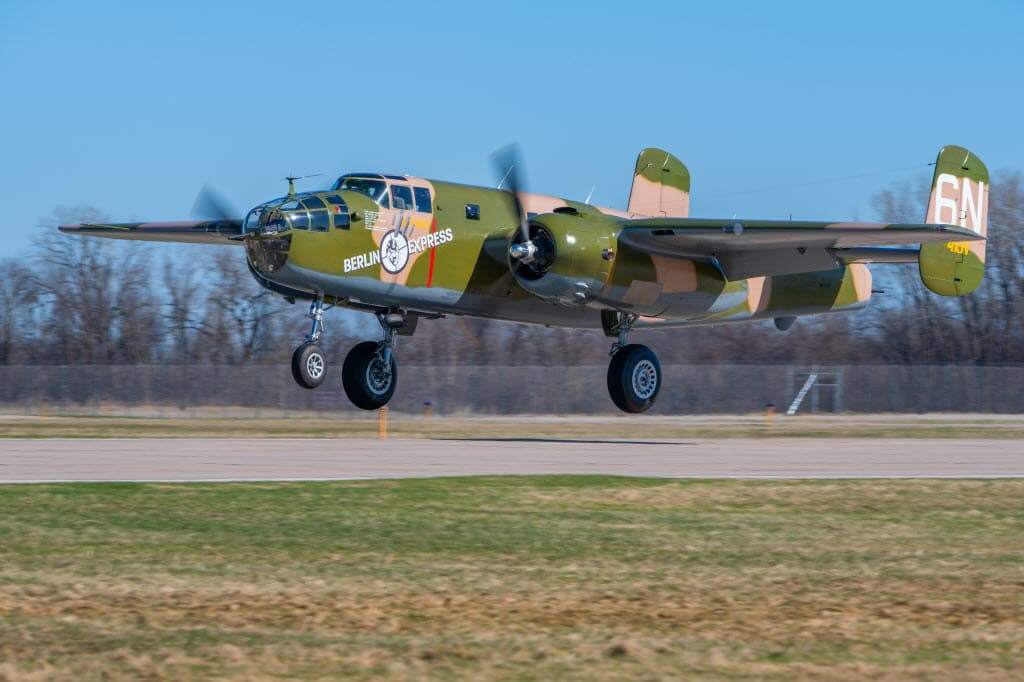 B-25 Berlin Express landing on a runway with landing gear down