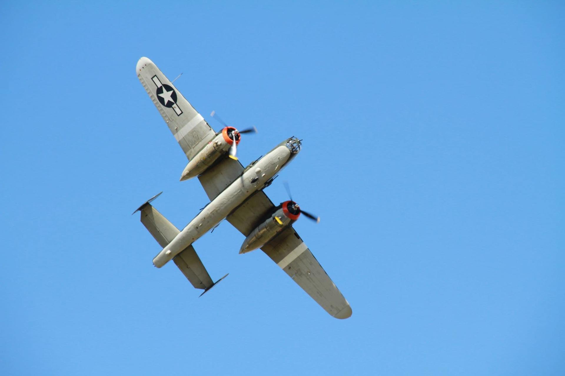 Underside view of B-25 against blue sky