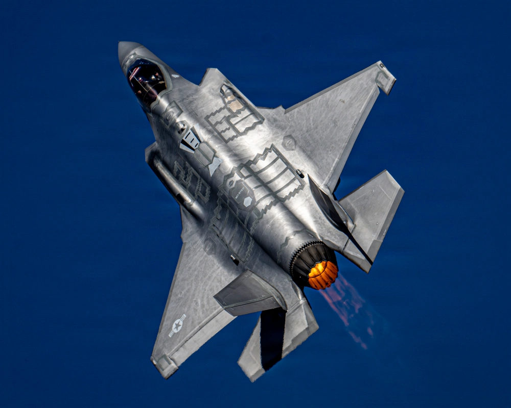F-35A Lightning II climbing into a vertical maneuver.