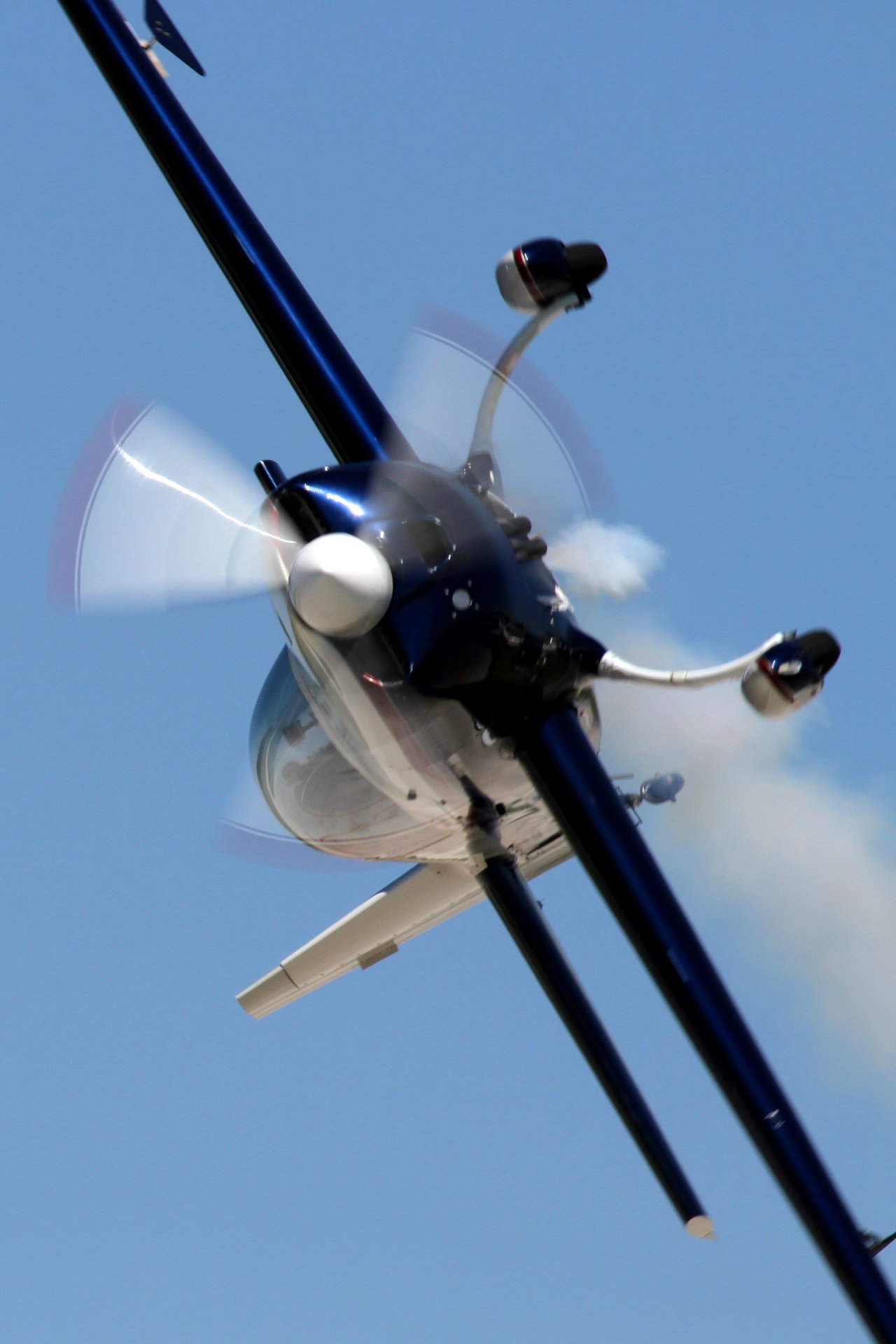 extra 300L banking to the left in a clear blue sky