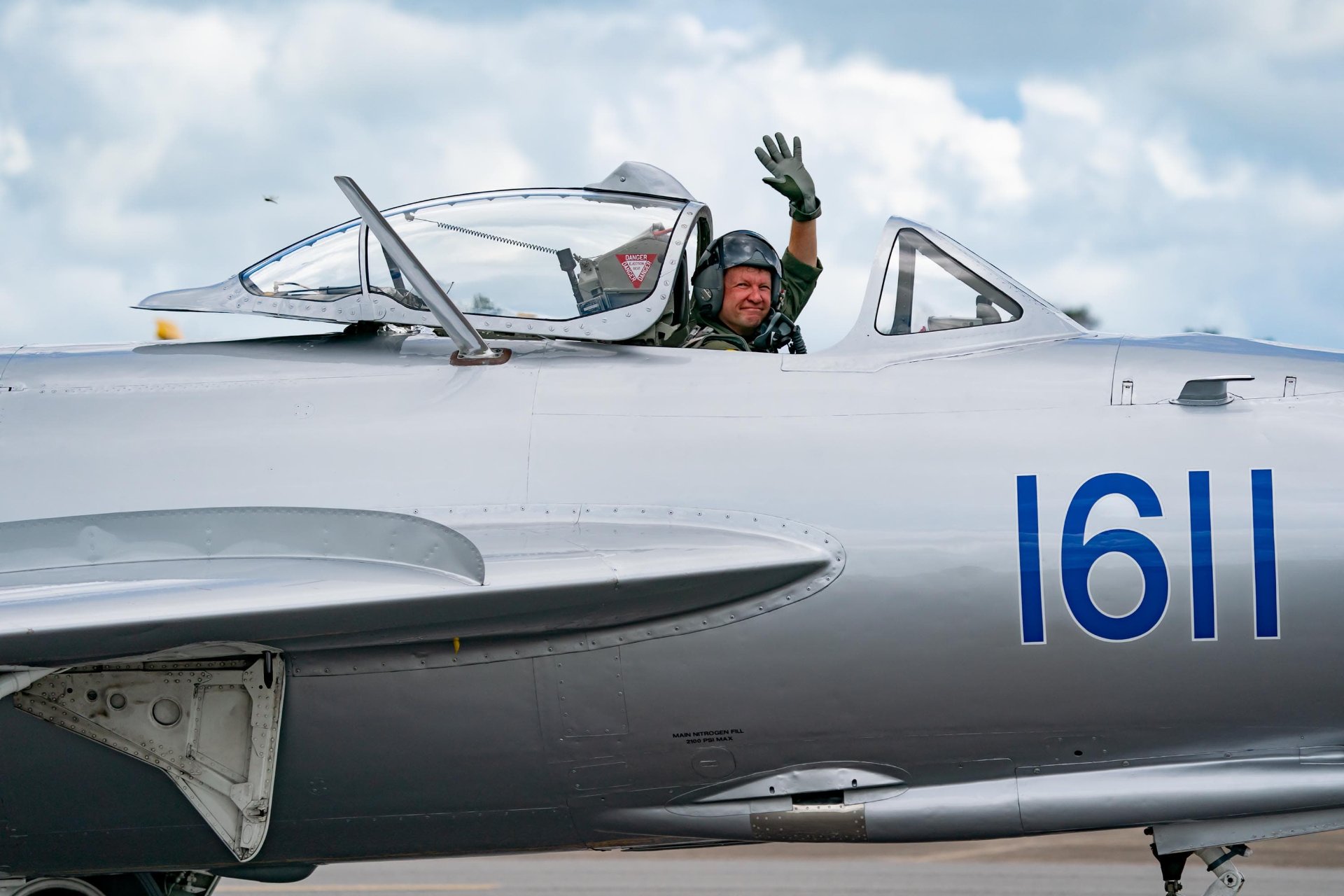 Randy Ball waves from the cockpit of MiG-17F number 1611 before takeoff.